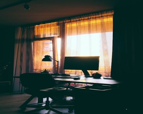 Desk setup placed perpendicular to a window to avoid direct glare